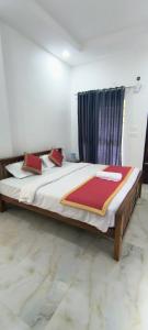 Ένα ή περισσότερα κρεβάτια σε δωμάτιο στο Blue home stay