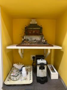 Příslušenství pro přípravu čaje a kávy v ubytování 'A Funtanella