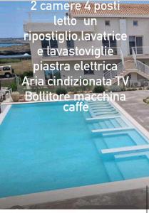 a sign for a villa with a swimming pool at Ortensia Apartment in Pachino