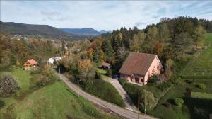 an aerial view of a house on a hill at Gîte de la Source de la Bruche in Bourg-Bruche