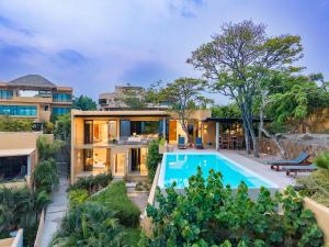 an aerial view of a house with a swimming pool at 3070 - La Cañada Villa H in Tangolunda