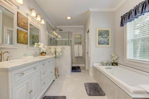 a bathroom with two sinks and a tub and a shower at The Winchester House - Serene Surroundings + Close to Downtown Jasper in West Brook +30 photos
