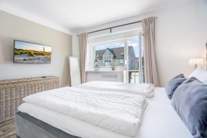 Ένα ή περισσότερα κρεβάτια σε δωμάτιο στο Hygge Sylt