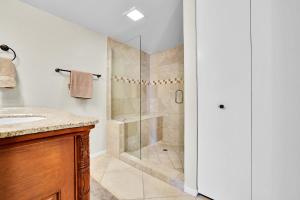 a bathroom with a shower and a sink at Relaxing Palm Springs Condo with Pool Access in Palm Springs