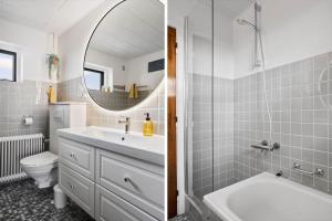 a bathroom with a sink and a toilet and a mirror at JB244-Logstor-Aggersborgvej-51 in Løgstør +17 photos