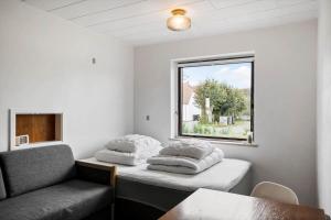 a room with two beds and a window at JB244-Logstor-Aggersborgvej-51 in Løgstør