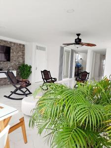 a living room with a couch and chairs at Large and beautiful Oceanfront Penthouse in Cartagena de Indias