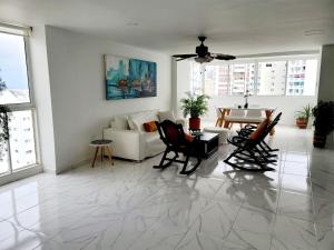 a living room with a couch and a table at Large and beautiful Oceanfront Penthouse in Cartagena de Indias