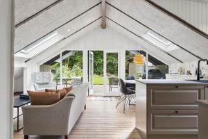 a kitchen and living room with a ceiling with skylights at JB273-Fjerritslev-Hasselvej-39 in Fjerritslev