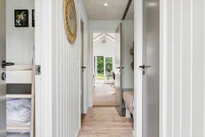 a hallway of a home with white walls at JB273-Fjerritslev-Hasselvej-39 in Fjerritslev +18 photos