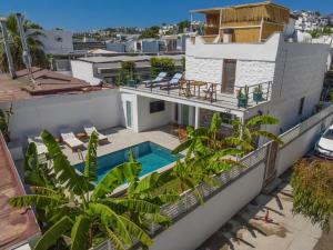 an aerial view of a house with a swimming pool at Traditional Seaside Stone Villa with Private Pool in Bodrum City
