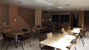 Pousada Café Com Leitte餐厅或其他用餐的地方