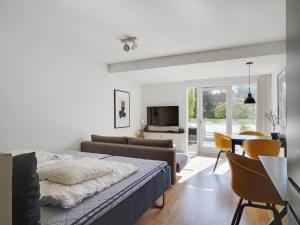 a bedroom with a bed and a living room at Apartment Liv - 50m from the sea by Interhome in Helsingør