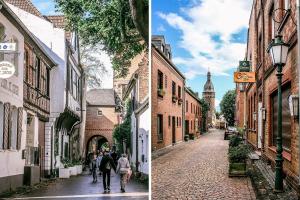 a group of people walking down a cobblestone street at Zu Gast im Denkmal St Peter in Dormagen