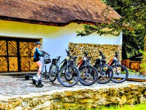 a person is standing next to a group of bikes at Nature rezidence private wellness in Zahorčice