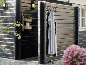 a wooden wall with a coat hanging on it at Holiday Home Anar - 900m from the sea by Interhome in Græsted