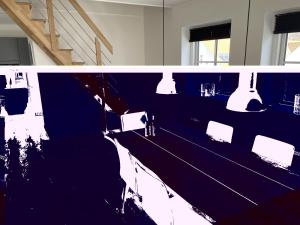 a room with a long table with chairs and lights at Apartment Almar - 293m from the sea by Interhome in Hjørring +7 photos