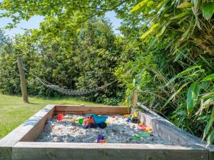 a sandbox with a toy truck in the sand at Holiday Home Elline - 450m from the sea by Interhome in Græsted