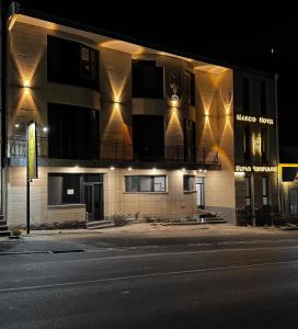 a building with lights on the side of a street at MARCO Hotel in Goris
