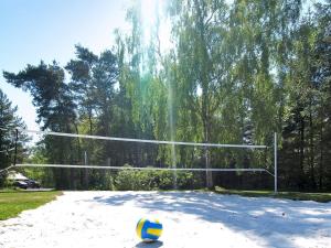 a volleyball ball sitting in front of a volleyball net at Holiday Home Ulla - 300m from the sea by Interhome in Neksø