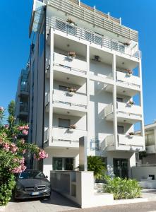 a car parked in front of a building at The One Hotel - Designed for Adults - Pet lovers in Riccione