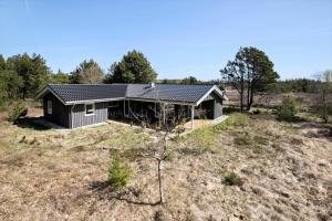 a house on top of a hill in a field at JB102-Fjerritslev-Blabaerstien-7 in Fjerritslev