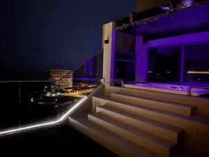 a set of stairs on a building at night at Seaview Jacuzzi Starry - 5 pax in Malacca