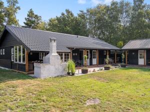 a house with a large yard in front of it at Holiday Home Kunegunda - 650m from the sea by Interhome in Yderby