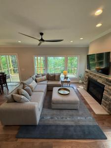 a living room with a couch and a fireplace at The Overlook at Lake James in Nebo