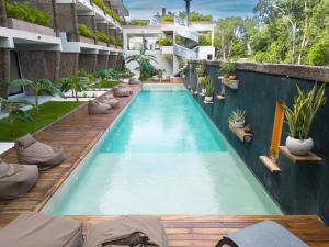 a swimming pool in a building with plants at TULUM XAMIRA PRIVATE SPA Balcony in Tulum