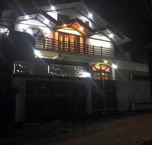 a house at night with lights on it at Midnight Oasis in Nuwara Eliya