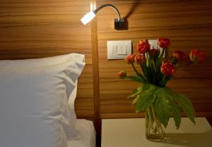 Voodi või voodid majutusasutuse Hotel Forum toas