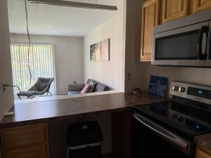 a kitchen with a counter top and a microwave at Modern 1br Retreat In Elkins Park - Long Term in Jenkintown