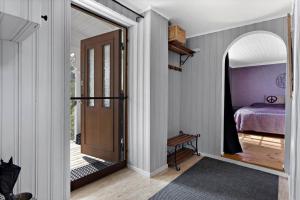 a room with a bedroom with a bed and a door at KAL472-Malilla-Virserumsvaegen-28 in Bäckeby