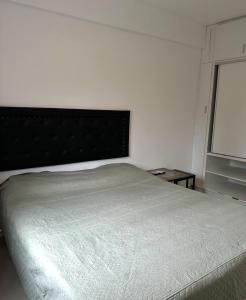 a bedroom with a large bed and a window at El Lapacho in Santiago del Estero +12 photos