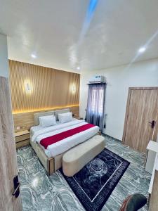 a bedroom with a large bed in a room at Lexworld Hotels in Aba