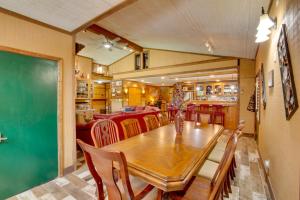 a dining room with a wooden table and chairs at Bayview - Lakefront Family Cabin in Odessa! in Odessa