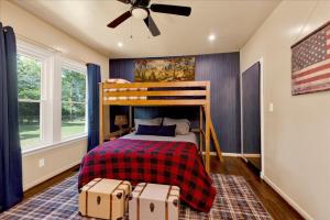 a bedroom with a bunk bed with twounks at #TheLakeHouse - Fun, Fishing & Games - Near Airport,BJCC,Downtown,Crossplex in Birmingham
