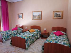 Ένα ή περισσότερα κρεβάτια σε δωμάτιο στο Casa Beretta