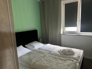 Ένα ή περισσότερα κρεβάτια σε δωμάτιο στο Duży Apartament 3 pokoje Park City