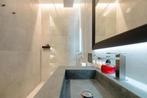 a bathroom with a sink and a mirror at Palazzo Panfilli Central Luxury in Trieste +42 photos