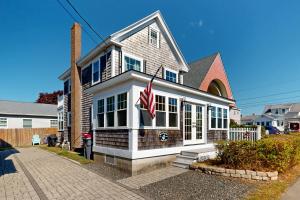 a house with an american flag in front of it at Seas the Day in Wells