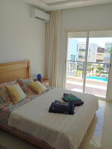 Katil atau katil-katil dalam bilik di Appart Confort - 6 pers - Piscine - Plage- El Mansouria