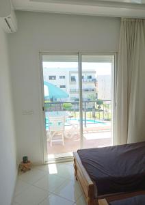 Katil atau katil-katil dalam bilik di Appart Confort - 6 pers - Piscine - Plage- El Mansouria +20 gambar