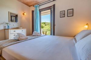 Postel nebo postele na pokoji v ubytování Eftihia cottage