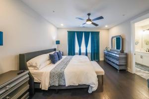 a bedroom with a bed and a dresser and a tv at Spectacular Vista in Atlanta