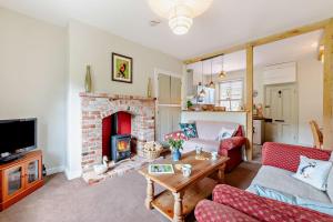 TV a/nebo společenská místnost v ubytování Railway Cottage Retreat