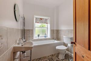 Koupelna v ubytování Railway Cottage Retreat + 16 fotografií
