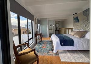 Ένα ή περισσότερα κρεβάτια σε δωμάτιο στο Blue Fish Cottage