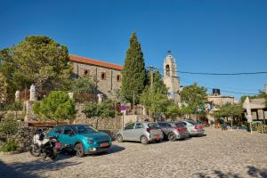 a group of cars parked in a parking lot at Avgonyma Nest in Avgonyma